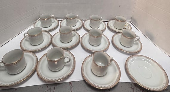 Set of 11 Porcelain Demitasse Cups and Saucers