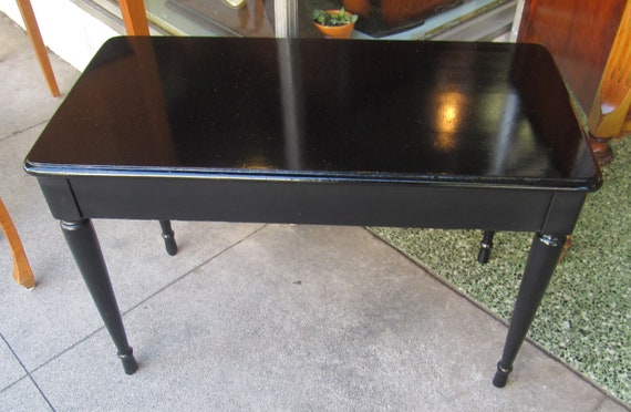 Black piano bench