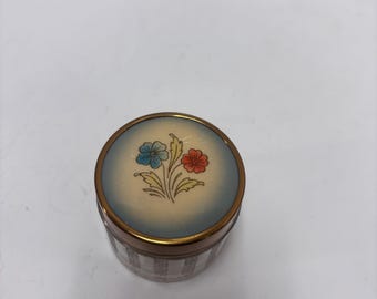 Tarro de tocador con motivo floral