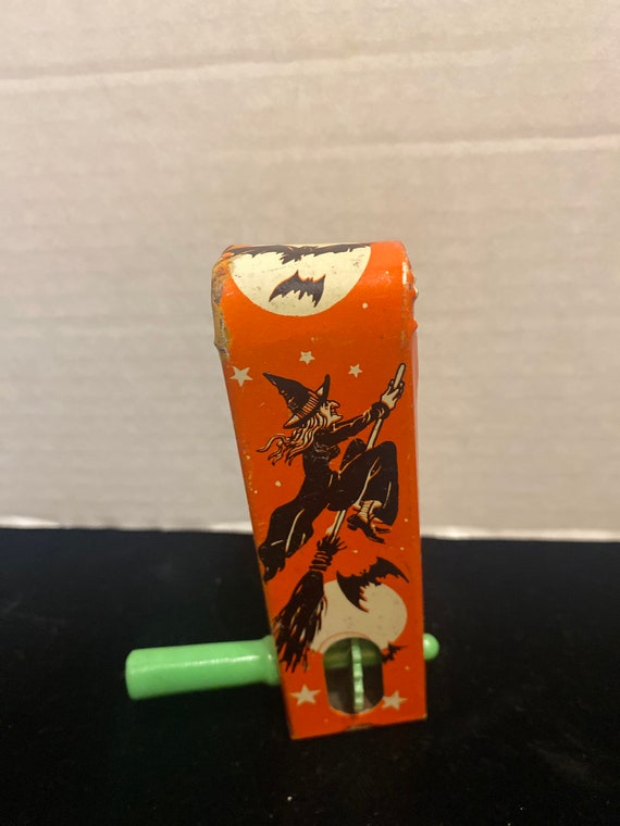 Halloween tin witch noisemaker toy