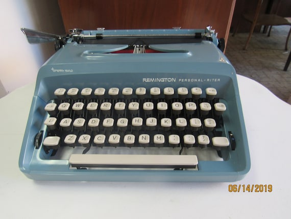 Blue portable typewriter