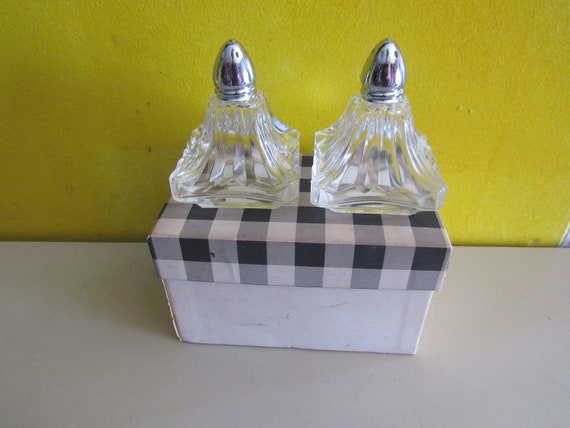 Vintage glass salt and pepper shakers unused