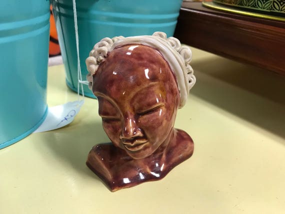 Pottery bust ethnic woman