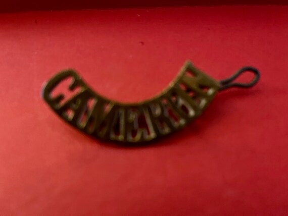 Cameron shoulder badge