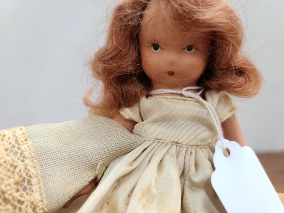 Nancy Ann storybook doll brown hair 5"bisque 1940's in original outfit.