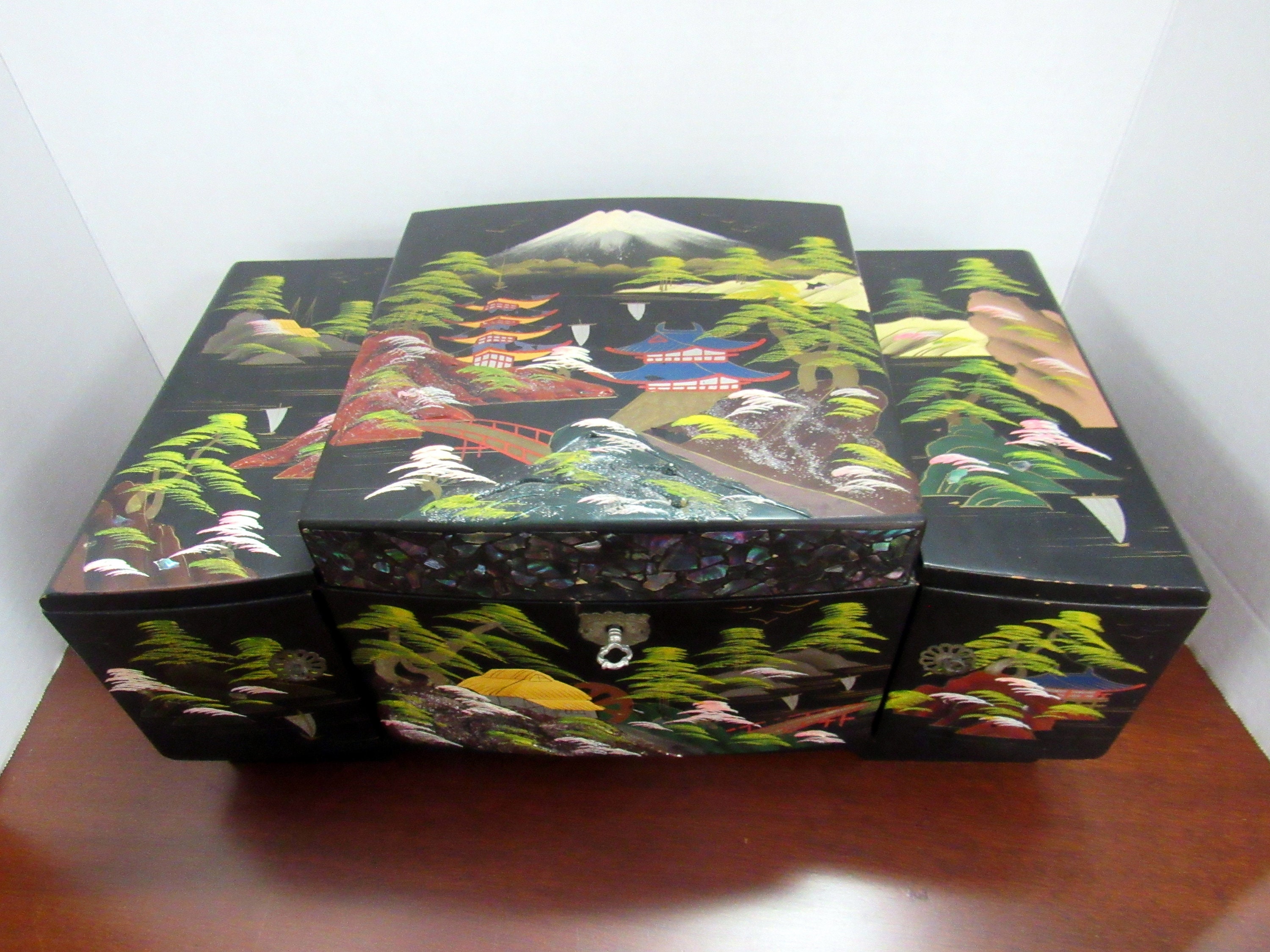 Asian black lacquer musical jewelry box with key