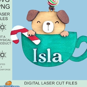 May include: A digital laser cut file design of a cartoon dog peeking out of a green coffee mug with a candy cane and a candy on top. The mug has the name "Isla" written on it.