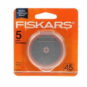 May include: A pack of Fiskars rotary blades. The orange packaging displays the Fiskars logo, the number 5, and the text "Rotary Blade". The blade is 4.5 mm in size.