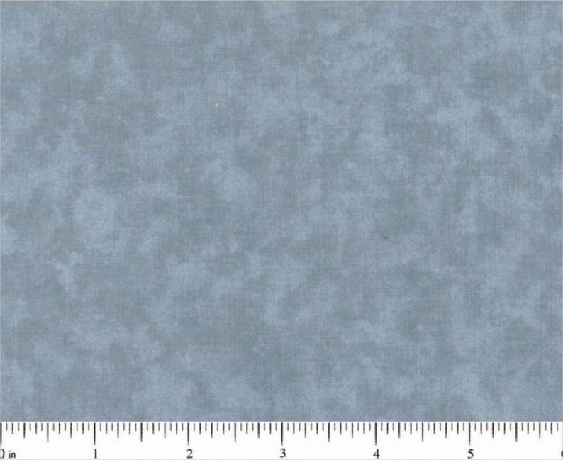May include: A close-up of a light blue fabric with a subtle mottled texture. The fabric has a slightly rough, linen-like feel.