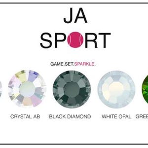 May include: A close-up of five different colored rhinestones. The rhinestones are labeled "Crystal", "Crystal AB", "Black Diamond", "White Opal", and "Green Tourmaline". The text "JA SPORT GAME.SET.SPARKLE." is above the rhinestones.