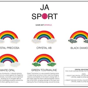 May include: A guide to choosing crystals for tennis ball dampeners. The guide features images of rainbows with different crystals, including Crystal Preciosa, Crystal AB, Black Diamond, White Opal, and Green Tourmaline. The text "JA SPORT GAME SET. SPARKLE." is at the top of the image.