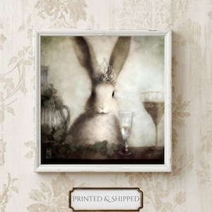 A framed painting depicting a white rabbit wearing a crown, surrounded by various objects such as a wine glass and a vase, set against a floral background.