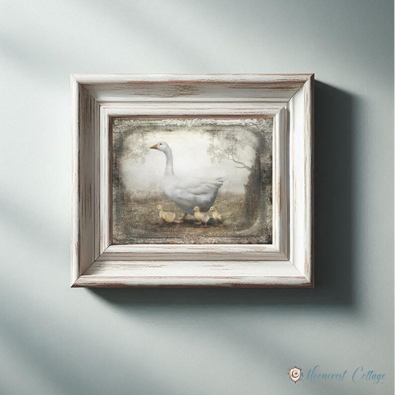 A framed painting of a white duck standing on a grassy area, with a group of smaller ducks nearby.