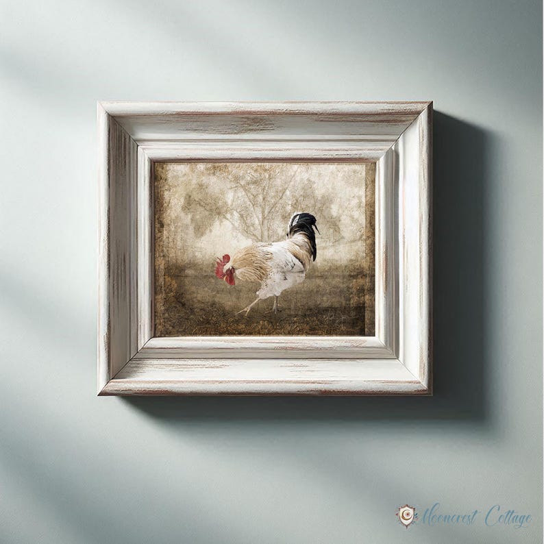 A framed painting of a rooster in a field, with a vintage or rustic appearance.