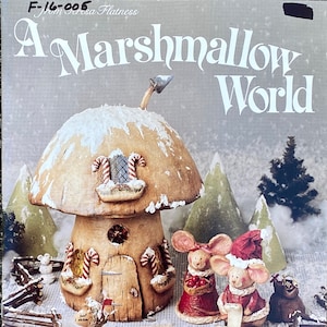 May include: A whimsical diorama titled "A Marshmallow World" features a mushroom-shaped house with candy cane accents and miniature mice figurines. The scene includes a snowy landscape with miniature trees and a rustic fence.