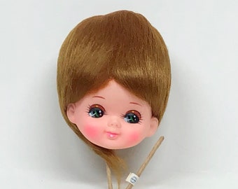 collectible dolls with big heads