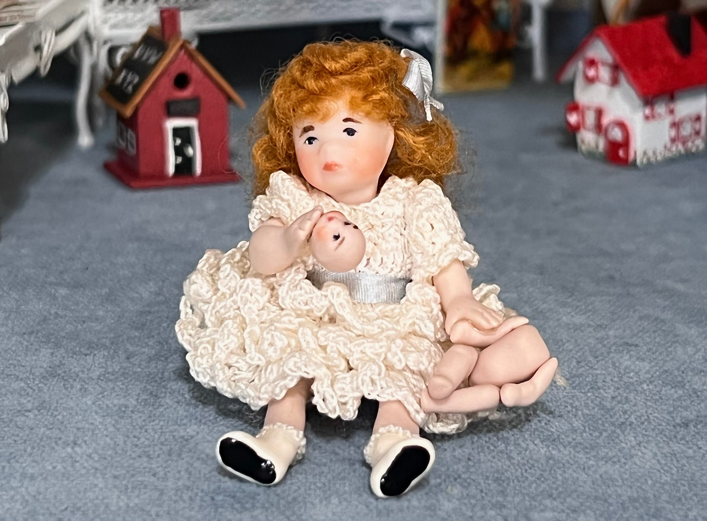 Miniature Bisque Jointed Doll Holding Broken Baby Doll