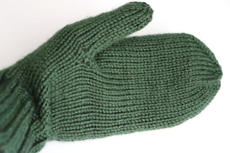 knitted mittens in dark sage green