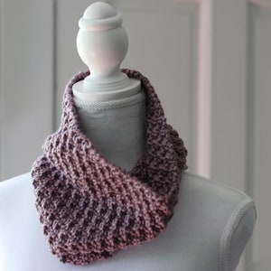purple knitted seed stitch cowl scarf on a white linen mannequin
