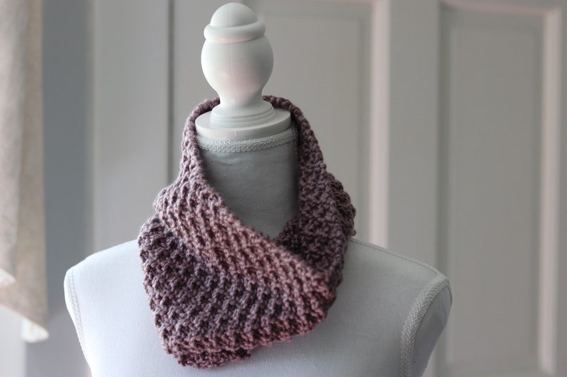 purple knitted seed stitch cowl scarf on a white linen mannequin