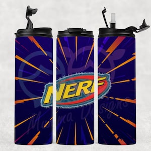 May include: Three insulated tumblers with black lids and a Nerf logo. The tumblers have a dark blue background with orange and yellow lightning bolt designs. The Nerf logo is in yellow, red, and blue.