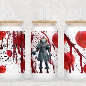May include: Three white glass tumblers with bamboo lids and straws. Each tumbler features a design with red balloons, blood splatter, and the text "WE ALL FLOAT DOWN HERE." One tumbler has a figure of a clown.