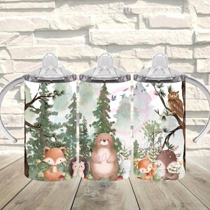 May include: Three sippy cups with forest animal illustrations. Each cup features a different forest scene with a fox, bear, owl, deer, and other animals. The cups have clear lids and handles, perfect for toddlers.