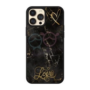 May include: Black phone case with a marble pattern and gold accents. The case features a heart, a stylized design, and the word "Love" in gold lettering.