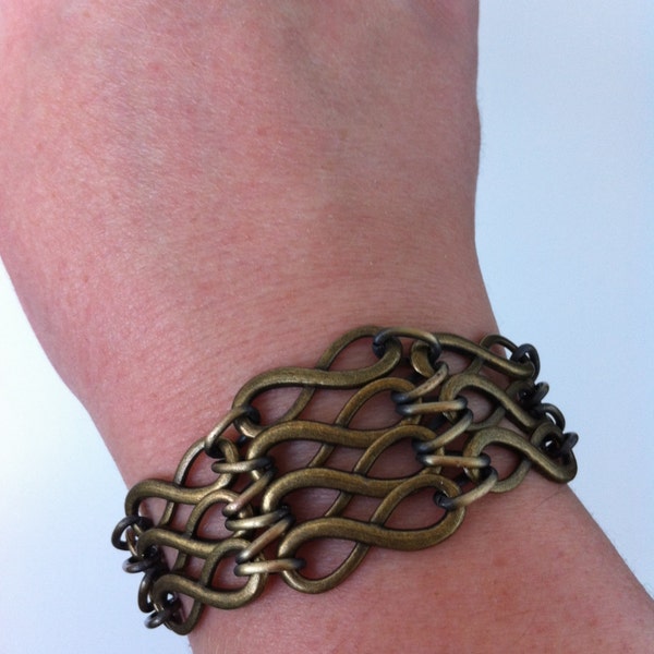 Infinectivity Web Drape Bracelet - Antique Brass Infinity Charms Linked with Bronze Rings.