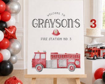 May include: A white rectangular welcome sign on a wooden easel featuring the text "WELCOME TO GRAYSON'S FIRE STATION NO. 3" in black, a small red firefighter helmet illustration, and a large watercolor-style red fire truck graphic.