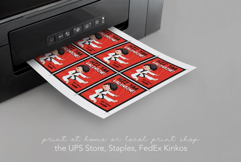 May include: A sheet of printable Valentine's Day cards featuring a cartoon karate kid with the text "Hi Yaa Valentine!" printed on a red background with black and white accents. The cards are being printed from a black printer.