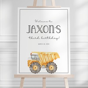 May include: Welcome to Jaxon's third birthday!  A white sign with black text and a yellow dump truck illustration.  The date March 18, 20XX is printed below the text.