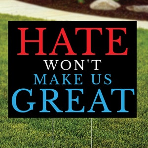 May include: Black yard sign with white, red, and blue text that reads "Hate Won't Make Us Great".