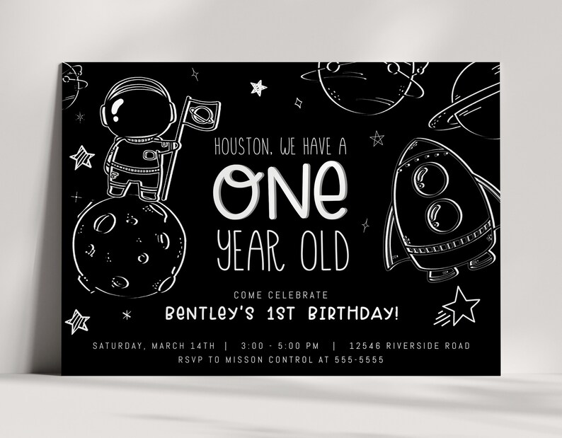 May include: Black and white birthday invitation with an astronaut standing on the moon. The text reads "Houston, we have a one year old. Come celebrate Bentley's 1st birthday! Saturday, March 14th | 3:00 - 5:00 PM | 12546 Riverside Road. RSVP to Mission Control at 555-5555."