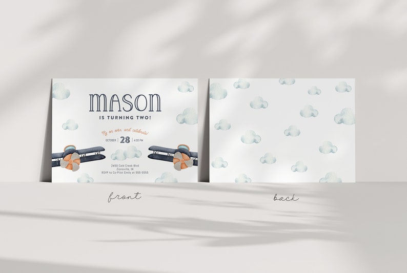 May include: A blue and orange airplane with a white background and clouds. The text "MASON IS TURNING TWO!" is on the invitation. The text "Fly on over and celebrate!" is on the invitation. The text "OCTOBER 28 | 4:00PM" is on the invitation. The text "2450 Cold Creek Rd, Jacksonville, IN RSVP to Co-Pilot Emily at 555-5555" is on the invitation.