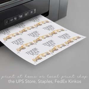 May include: A sheet of paper with a repeating pattern of yellow construction trucks and the text "Thank You!" printed on it. The paper is being fed into a black printer. The text "print at home or local print shop the UPS Store, Staples, FedEx Kinkos" is printed below the printer.