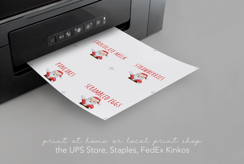 May include: A sheet of paper with Santa Claus illustrations and text that reads "Chocolate Milk", "Strawberries", "Pancakes", and "Scrambled Eggs". The paper is being printed from a black printer. The text below the paper reads "print at home or local print shop the UPS Store, Staples, FedEx Kinkos".
