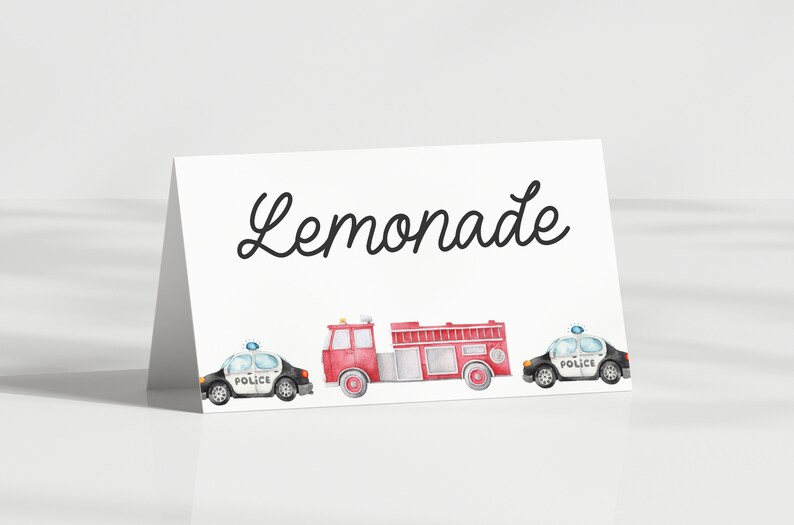 May include: A white card with the word "Lemonade" written in black cursive. There are three watercolor illustrations of vehicles: a red fire truck, and two black and white police cars.