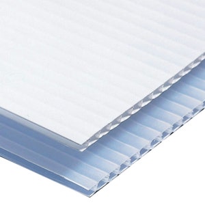 May include: Two sheets of white corrugated plastic, one on top of the other. The top sheet is white, and the bottom sheet is a light blue.