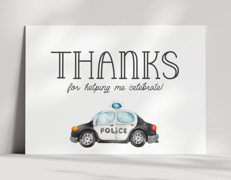 May include: A white thank you card with black text that says "THANKS for helping me celebrate!" and a watercolour illustration of a black and white police car with a blue light on top.