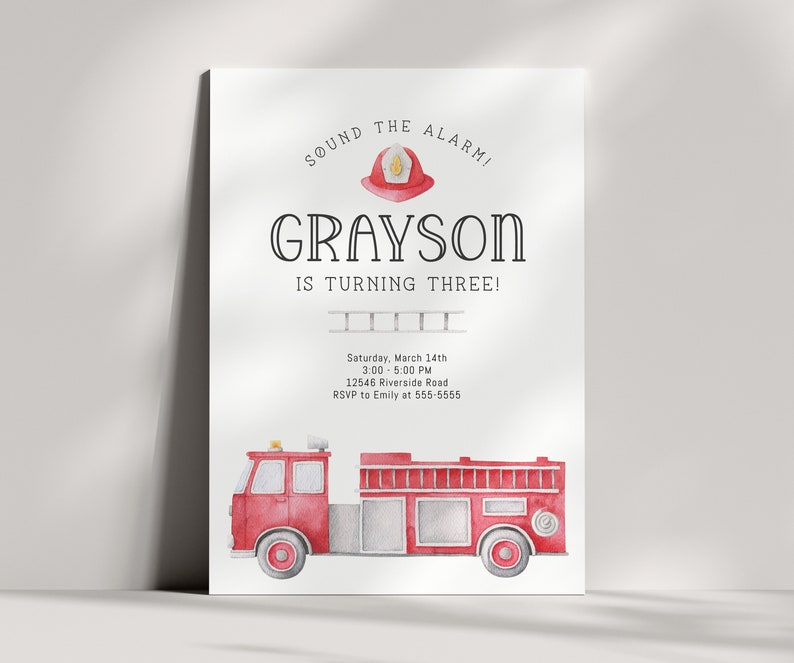 A birthday invitation with a red fire truck and a firefighter helmet. The text reads 'Sound the alarm! Grayson is turning three! Saturday, March 14th 3:00-5:00 PM 12546 Riverside Road RSVP to Emily at 555-5555'