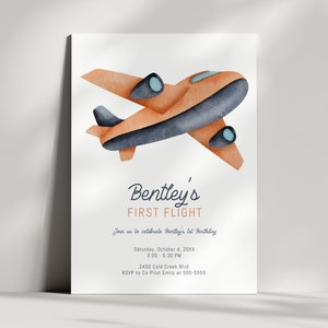 May include: A watercolor illustration of an orange airplane with blue accents. The text "Bentley's First Flight" is written in a navy blue cursive font. The invitation includes the date, time, and location of the event. RSVP information is also included.