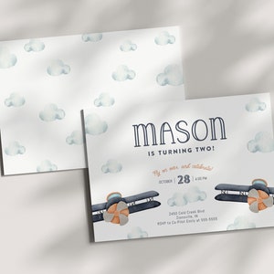 May include: A blue and white airplane birthday invitation with clouds and the text "MASON IS TURNING TWO!"  Fly on over and celebrate! October 28 | 4:00 PM 2450 Cold Creek Blvd Zionsville, IN RSVP to Co-Pilot Emily at 555-5555