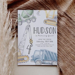 May include: Construction themed birthday party invitation featuring a blue dumper truck, a yellow bulldozer, a green cement mixer, and a yellow crane. The invitation reads "Hudson is turning four!" and includes the date, time, and location of the party.