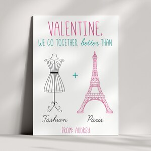 May include: A Valentine's Day card with a pink Eiffel Tower and a black fashion mannequin. The text reads "VALENTINE, WE GO TOGETHER better THAN Fashion + Paris FROM: AUDREY".