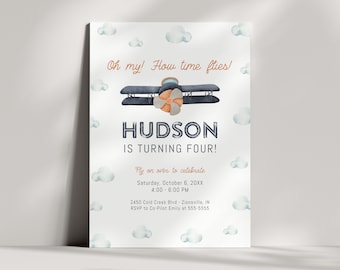 May include: A blue and white airplane with an orange propeller is flying in a sky with white clouds. The text "Oh my! How time flies!" is at the top of the invitation. The text "HUDSON IS TURNING FOUR!" is in the middle of the invitation. The text "Fly on over to celebrate" is at the bottom of the invitation. The text "Saturday, October 6, 20XX 4:00 - 6:00 PM" is below the text "Fly on over to celebrate". The text "2450 Cold Creek Blvd - Zionsville, IN" is below the date and time. The text "RSVP to Co-Pilot Emily at 555-5555" is at the bottom of the invitation.