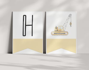 May include: Two framed prints. The left print features a black outlined letter "H" on a white background with a yellow banner. The right print shows a yellow construction crane on a white background with a yellow banner. The prints are displayed on a white surface.