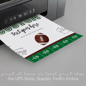 May include: A printable 8x10 inch sign template with a football design. The sign says "Custom text goes here". The sign is being printed on a printer.