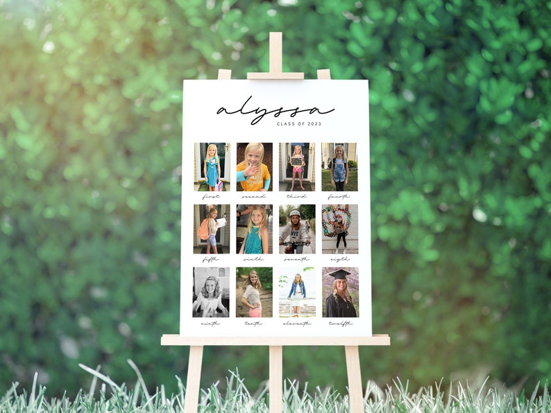 May include: A white poster board with a black handwritten name "Alyssa" and "Class of 2023" printed below. The poster board is divided into a grid of 12 squares, each containing a photo of a girl from different ages. Each square has the grade number printed below the photo.