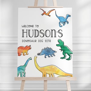May include: Welcome to Hudson's Dinosaur Dig Site sign with watercolor illustrations of dinosaurs in various colors, including orange, yellow, green, and blue.